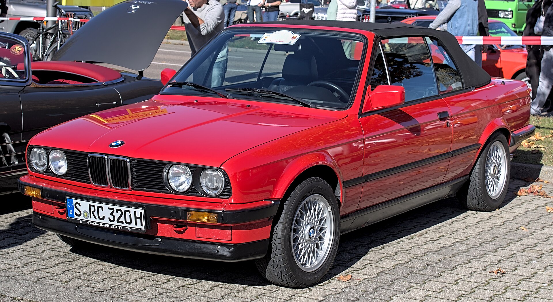 Red BMW E30 Cabriolet photographed from the front three-quarter view