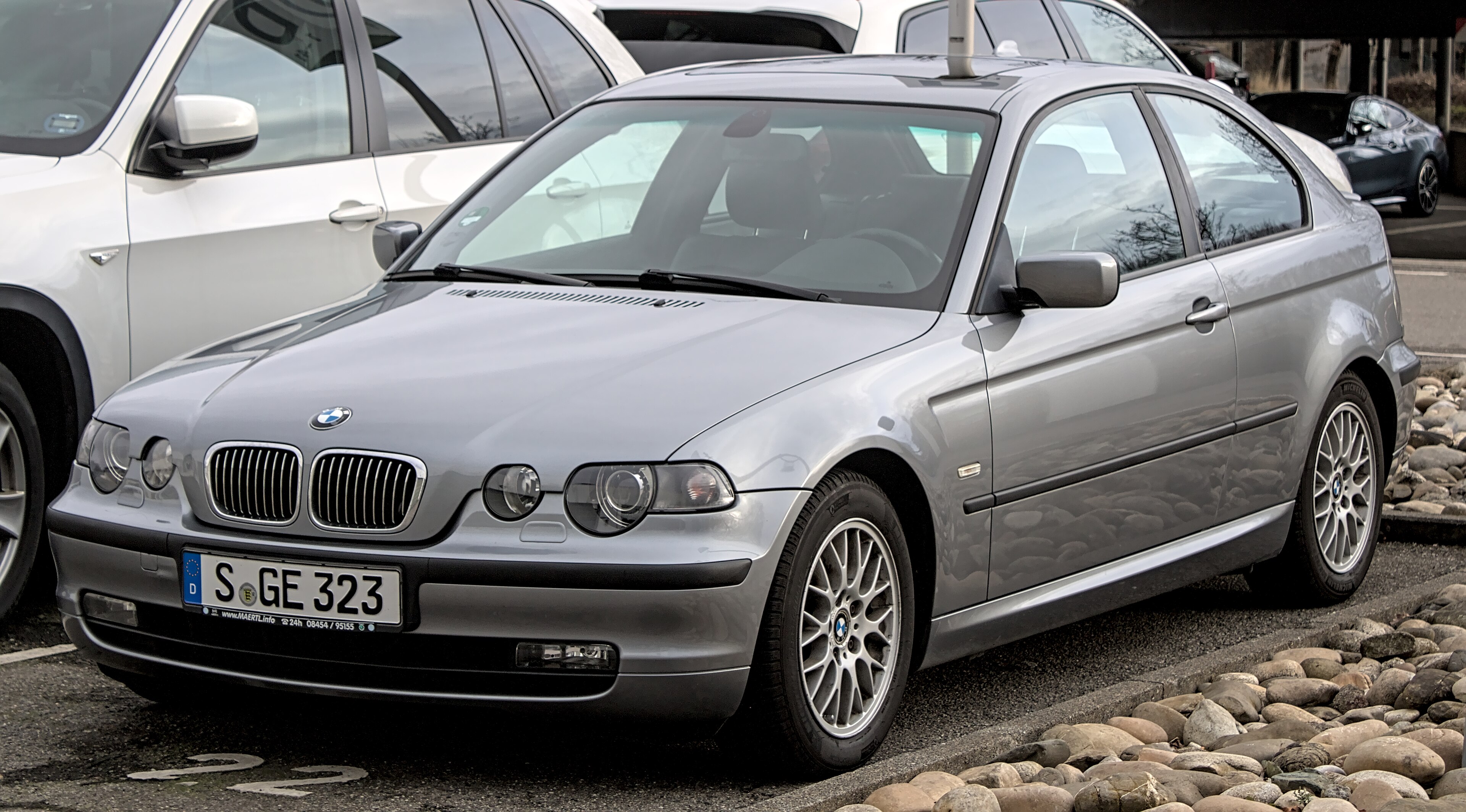Silver BMW E46 Compact photographed from the front three-quarter view