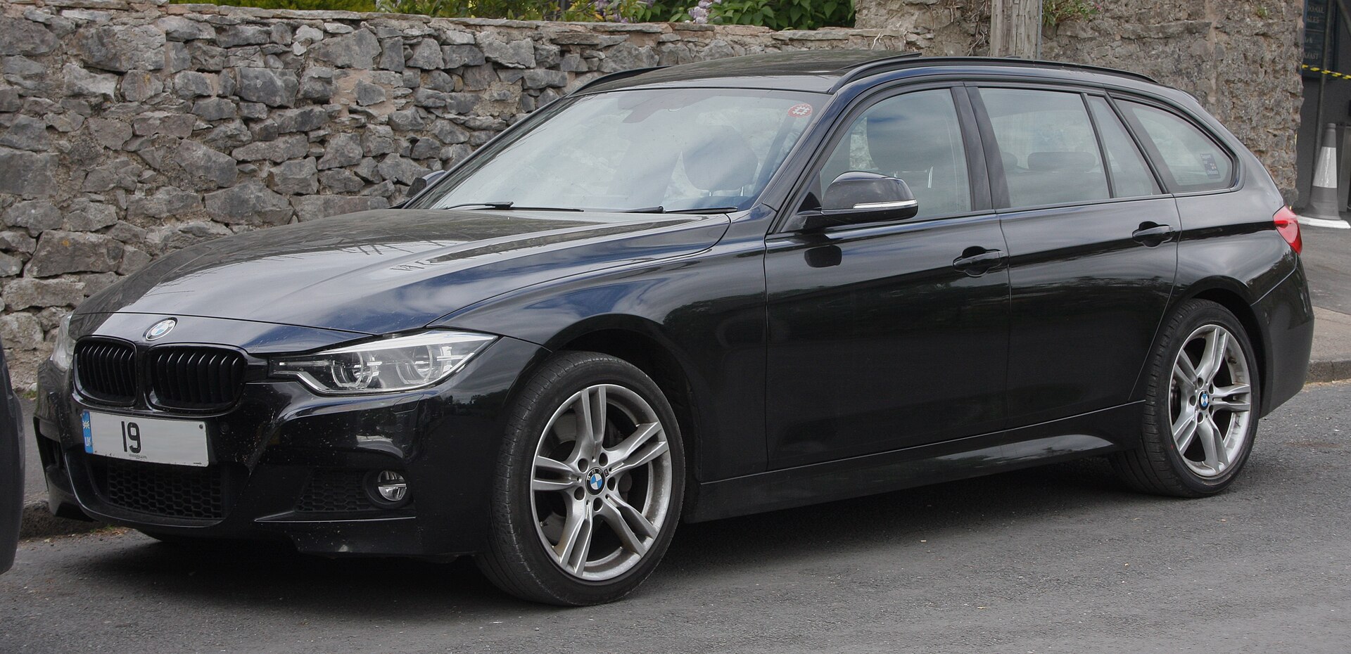 Black BMW F31 Touring photographed from the front three-quarter view