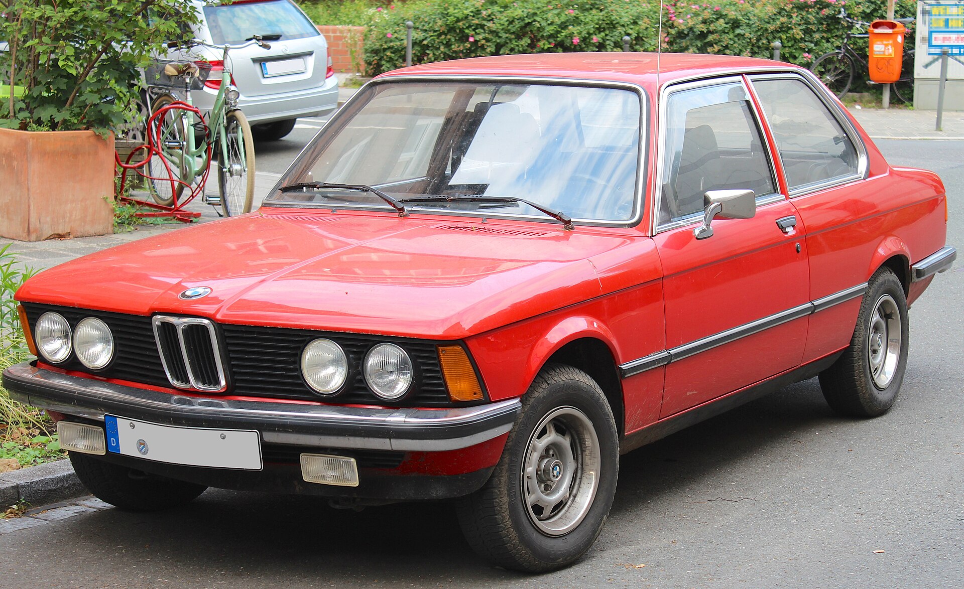 Red BMW 3 Series E21 photographed from the front three-quarter view